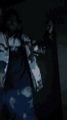 a blurry picture of a person wearing a shirt that says ' a ' on it