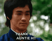 bruce lee says " thank you auntie h " in front of trees