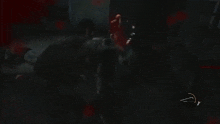 a man with a gun in his mouth is being attacked by another man