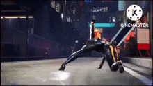 a person in a black and yellow suit is laying on the ground .