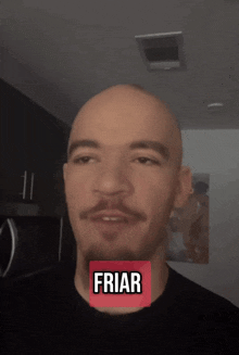 a bald man with a mustache has a red sticker on his face that reads friar