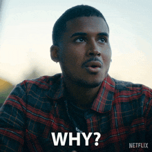 a man wearing a plaid shirt is asking the question " why "