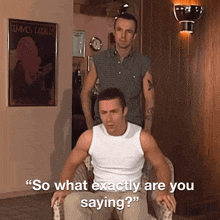 a man sitting in a chair with the words so what exactly are you saying behind him