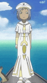 a girl in a sailor outfit stands on a boat in the ocean