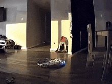 a room with a few chairs and a car in it