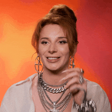 a woman wearing a bun and a bunch of chains