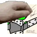 a close up of a hand holding a piece of paper with a drawing of a person on it .