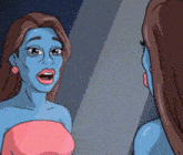 a woman in a pink dress is looking at herself in the mirror .