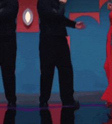 a man and a woman are dancing together on a stage