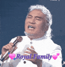a man singing into a microphone with the words royal family on the bottom right