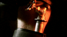 a close up of a person 's foot with a red light behind it