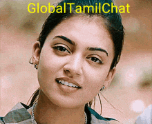 a close up of a woman 's face with the words global tamilchat above her