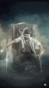 a man is sitting in a chair holding a sword in his hand
