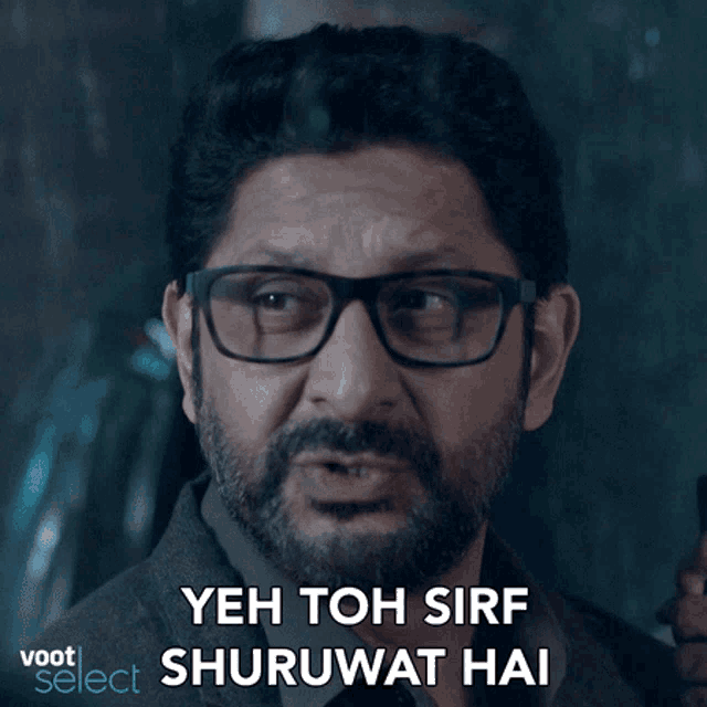 a man with glasses and a beard says yeh toh sirf shuruwat hai
