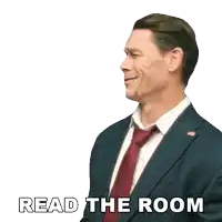 a man in a suit and tie says " read the room " on a white background