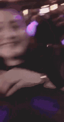 a blurry picture of a woman sitting at a table
