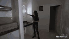 a woman is standing in a kitchen with the words made in animotica on the bottom