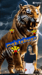 a woman is standing in front of a tiger with the word mak tebuah written on it