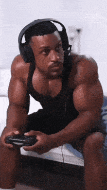 a man wearing headphones and holding a video game controller