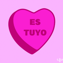 a pink heart with the words es tuyo written on it