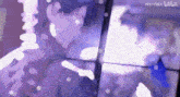 a blurry picture of a person with chinese writing on the bottom left