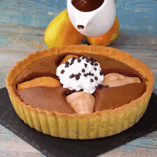 a pie with chocolate chips and whipped cream on top