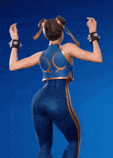 a woman in a blue and gold outfit with the letter s on the back