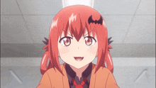 a girl with red hair and a bat on her ear