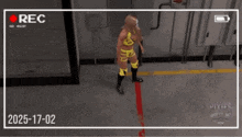 a video of a wrestling match is being recorded with the date 2025-17-02