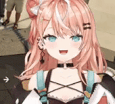 a close up of a pink haired anime girl with blue eyes and a cat ear .