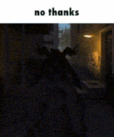 a picture of a person in a dark room with the words no thanks on the bottom