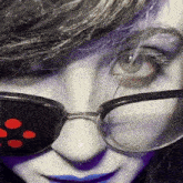 a close up of a person 's face with glasses and blue lips