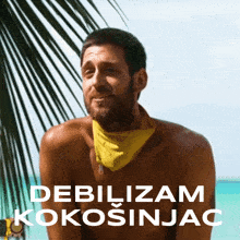 a shirtless man with a yellow bandana around his neck is sitting under a palm tree on the beach