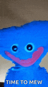 a blue stuffed animal with big eyes and a pink mouth is saying time to mew