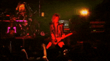 a man is playing a guitar in front of a marshall amp
