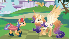 two ponies are standing next to each other on a checkered field