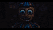 a cartoon character with glowing blue eyes and a button on his chest