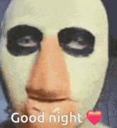 a person with a mask on says good night with a heart