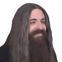 a man with long hair and a beard is smiling for the camera .