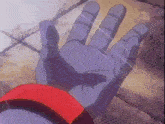 a close up of a hand with a red ring around it