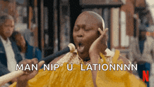 a bald man singing into a microphone with the words man nip u lationnn