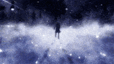a person is standing in the middle of a snowy field .