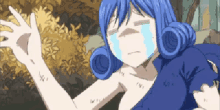 a girl with blue hair is crying with her eyes closed and her hands outstretched .