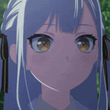 a close up of a girl 's face with a surprised look on her face