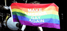 a rainbow flag that says " make america gay again "