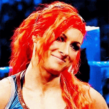 a woman with red hair is smiling in a pixelated photo