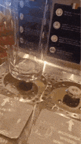 a glass of water is being poured into a machine ..