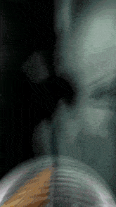 a blurred image of a person 's face with a few lines