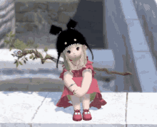 a little girl in a red dress and black hat is sitting on a ledge