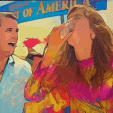 a woman drinking from a bottle in front of a sign that says ' coast of america '